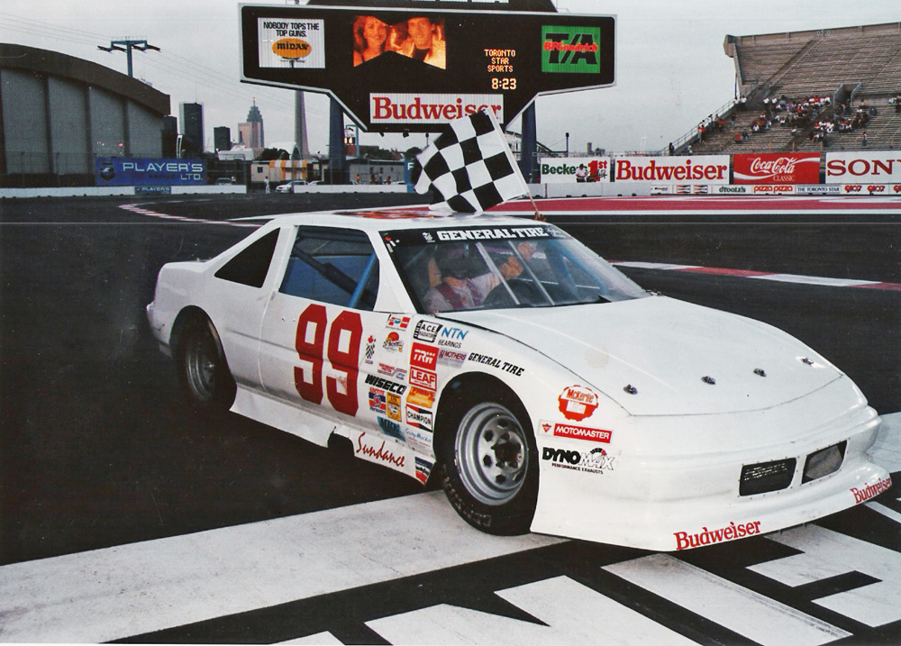 Scott Watkins takes a CASCAR heat win in 1990. Photographer unknown. Courtesy of Ernie Pothier.