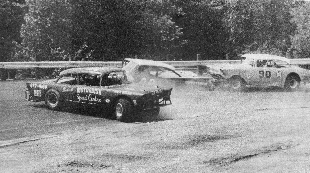 Don Beckford (#26) spins while Gary Coppins (#44) and Doug Warnes (#90) go by on the outside at Westgate in 1967. This photo appeared in Wheelspin News and was credited to Waymark.
